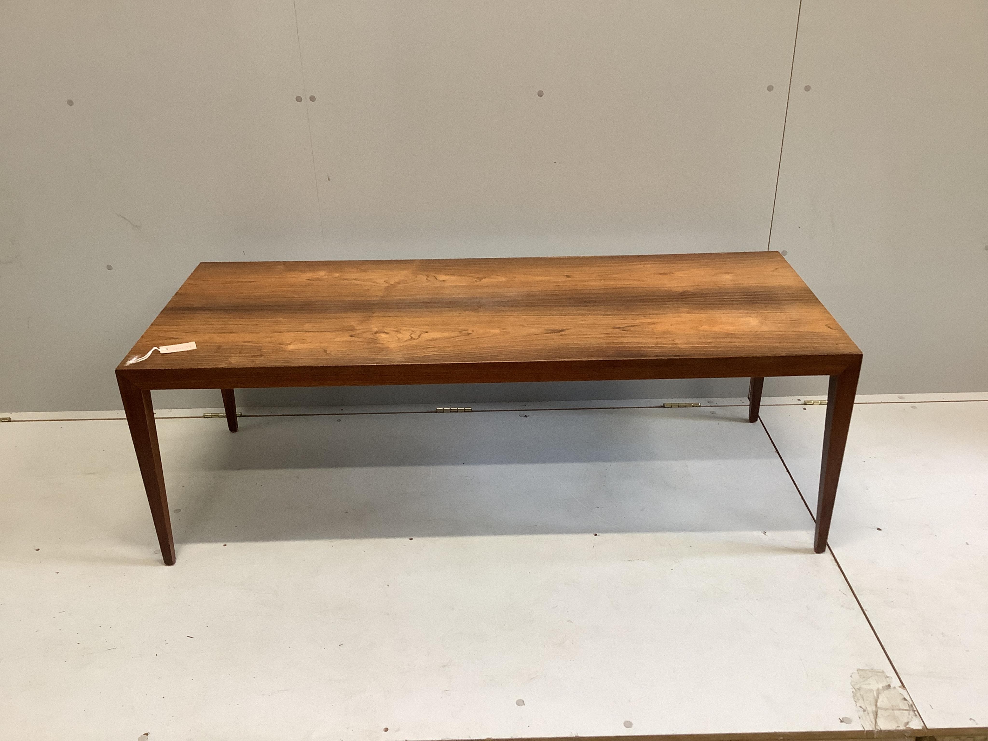 In the manner of Johannes Anderson, a mid century rectangular Indian rosewood coffee table, width 150cm, depth 60cm, height 50cm